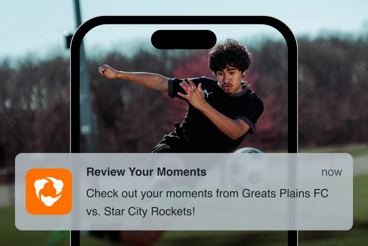 Photoillustration of Alex's phone, with a Hudl notification that reads 'Check out your moments from Great Plains FC vs. Star City Rockets!'